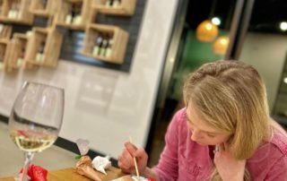 Person decorating cookies at the winery